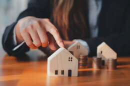 businesswoman considering investing in property