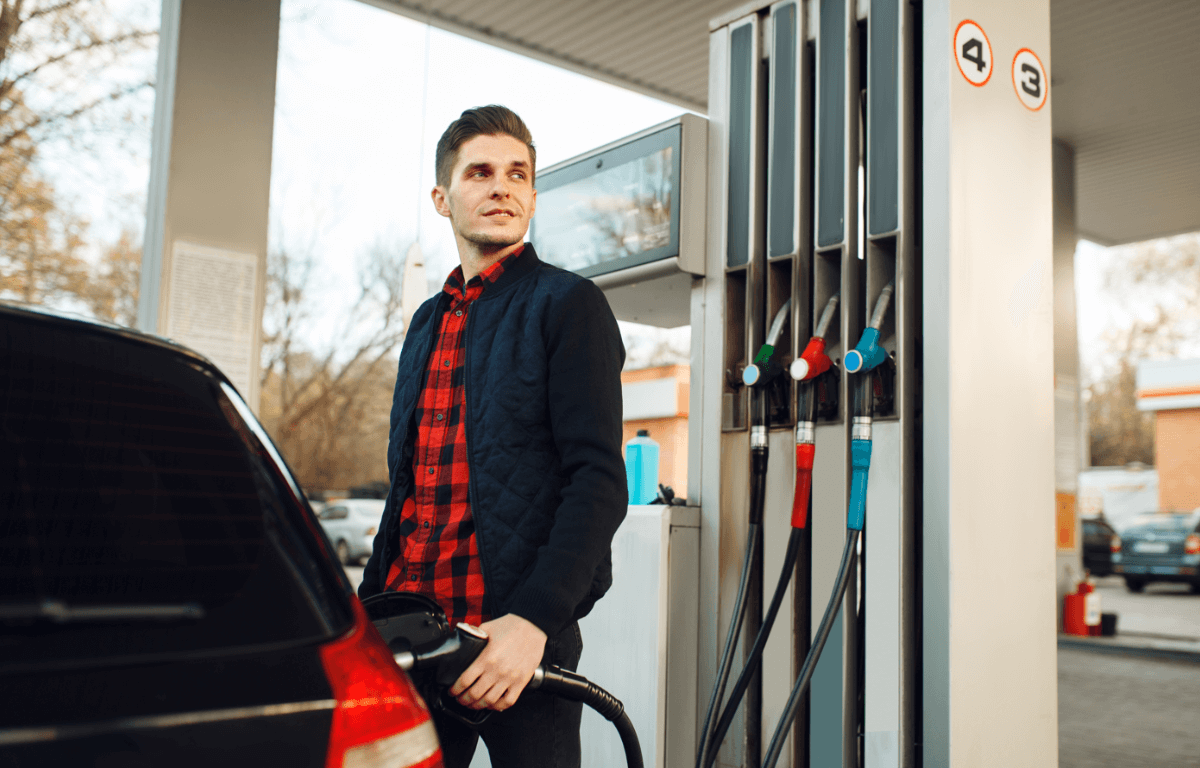 man filling car with petrol