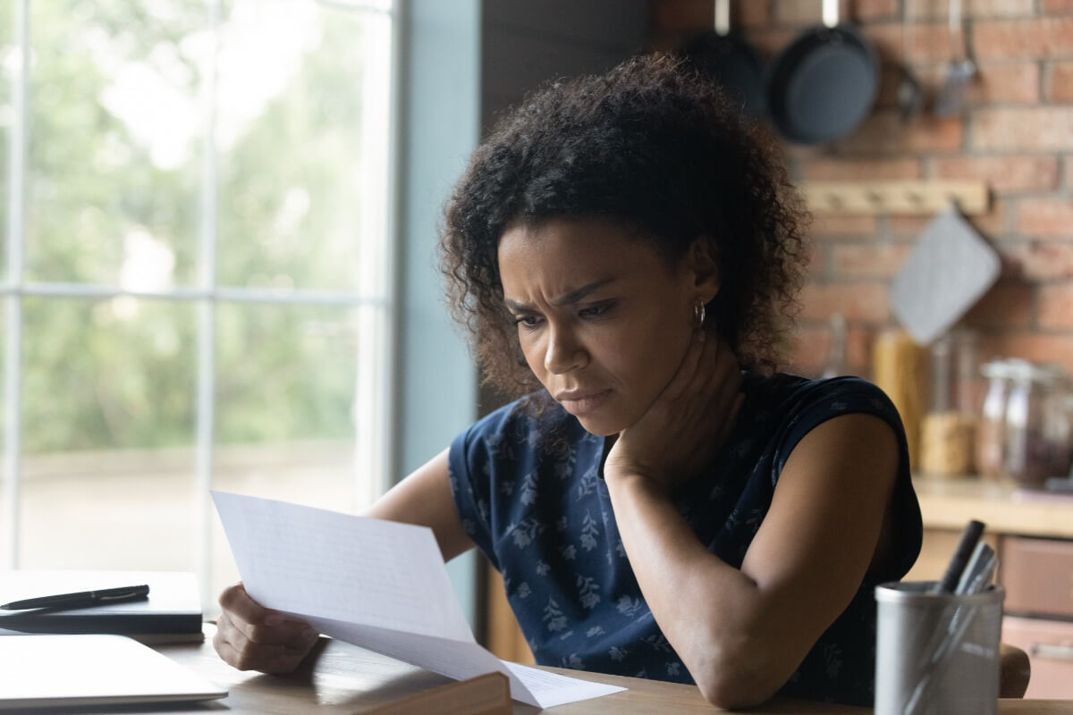 woman with health insurance renewal notice