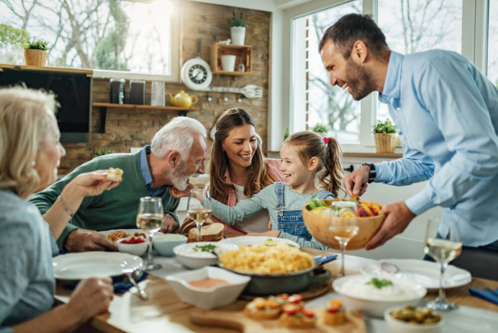 Family with life insurance eat together