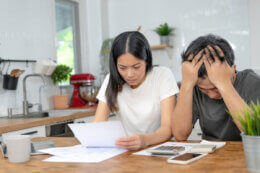 couple with an electricity bill
