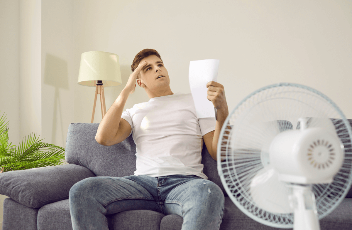 man saving on energy bills in summer