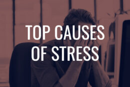 a man rubbing his eyes with a title card overlay reading "Top Causes of Stress"