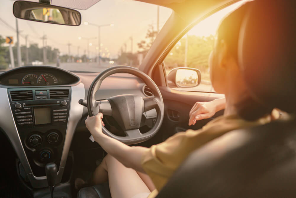 woman saves money with cheaper car insurance