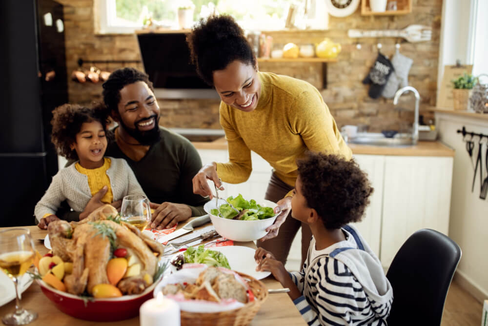 Family with term life insurance have dinner