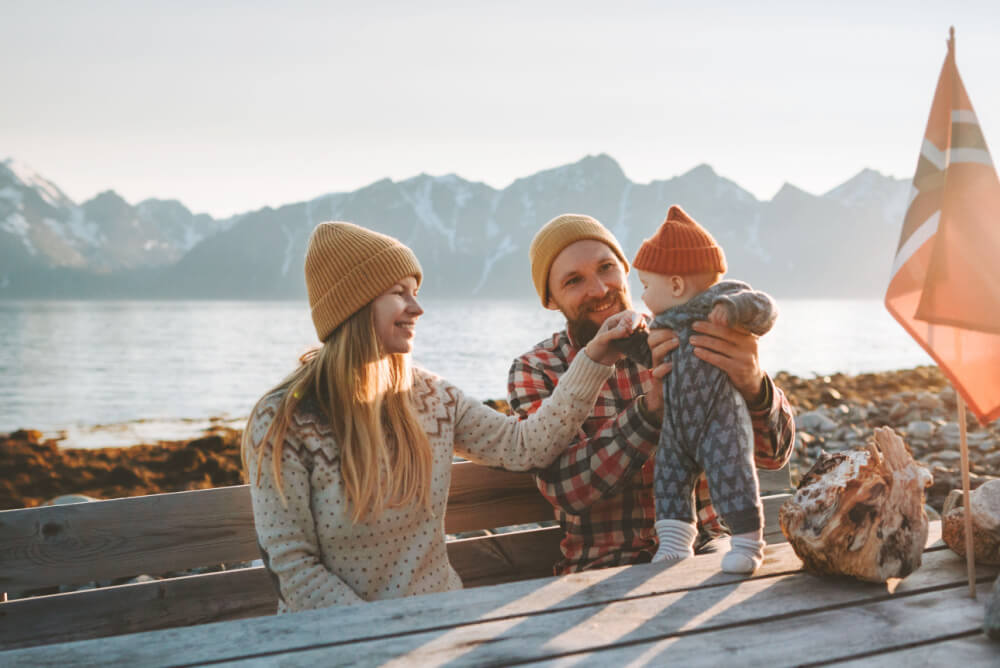 Happy family with cancellation cover on holiday in Norway