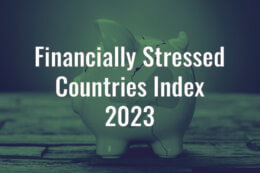 a cracked and bandaged piggy bank with a title overlay reading "Financially Stressed Countries Index 2023"