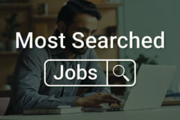 a man searching for jobs online with the words "Most Searched Jobs" overlaid