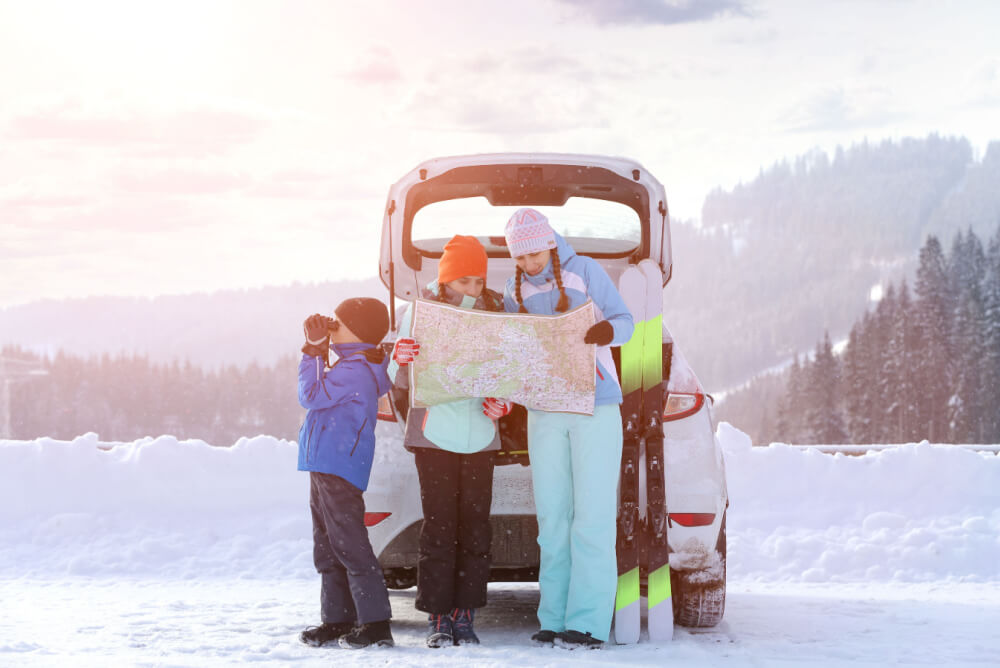 Family on ski holiday with family travel insurance