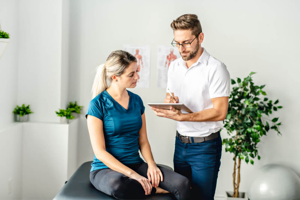 Woman visits chiropractor for back pain