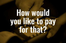 a hand paying for something with a credit card in an EFTPOS machine