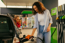 woman filling car with petrol
