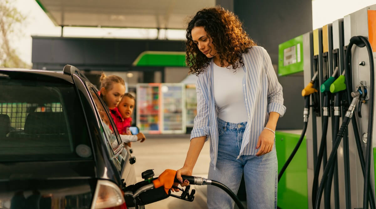 woman filling car with petrol