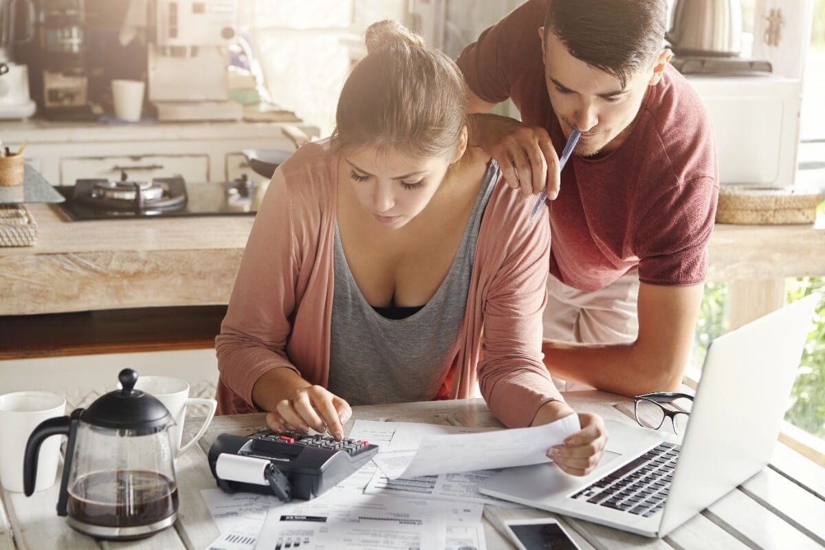 couple cutting back on essentials