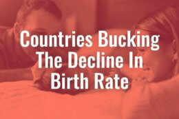 parents looking at baby on bed with fed filter and title card reading "Countries Bucking The Decline In Birth Rate"