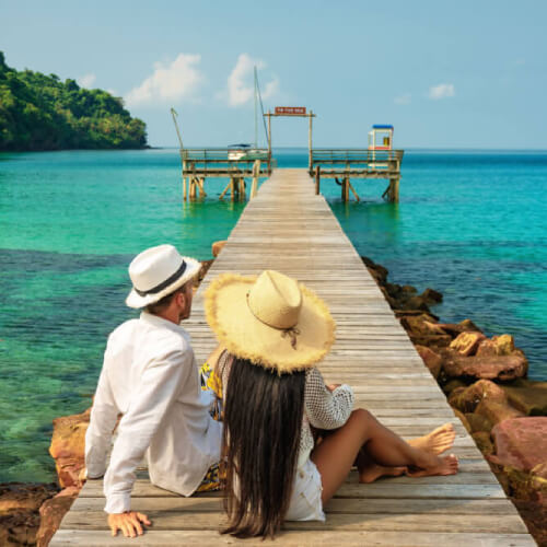 Couple on dock with travel insurance in Fiji