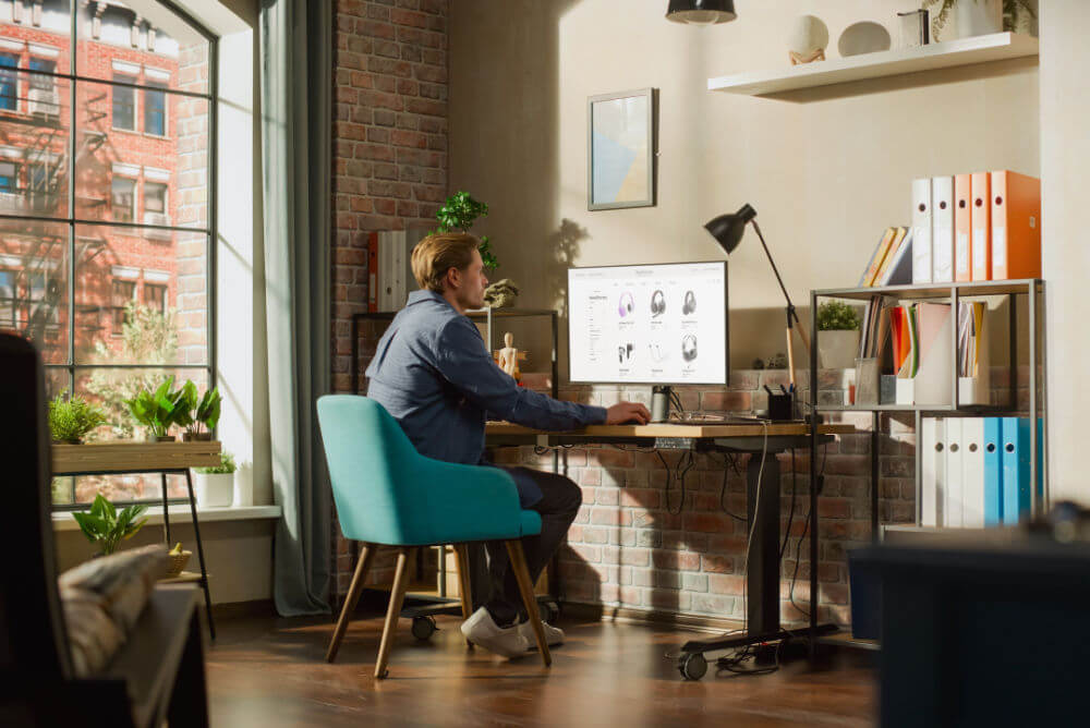 Man using an energy-efficient computer monitor at home