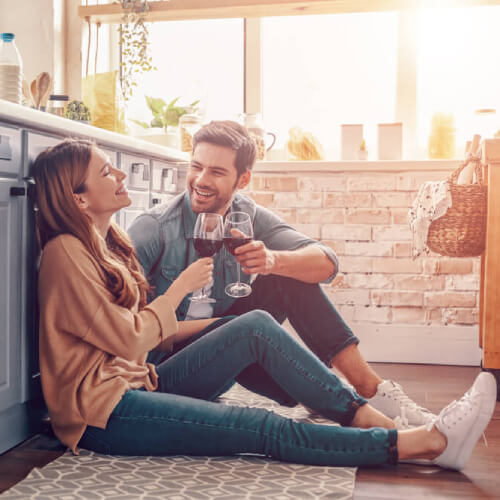 Couple relaxing on kitchen floor