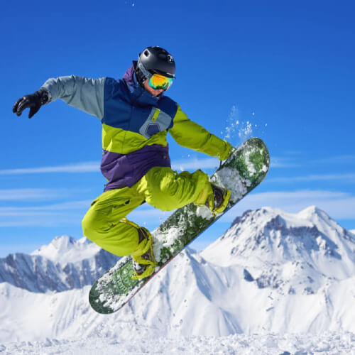 Man doing snowboard tricks with ski cover