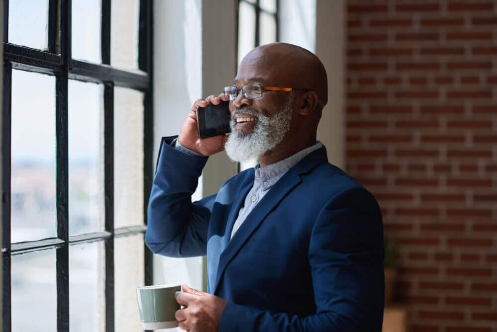 Man on phone with flood insurance