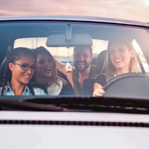 Young drivers enjoying a road trip