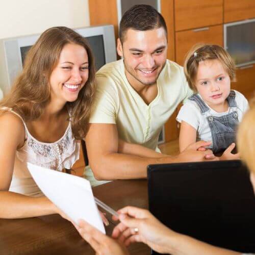 young family learns about the health insurance tiers