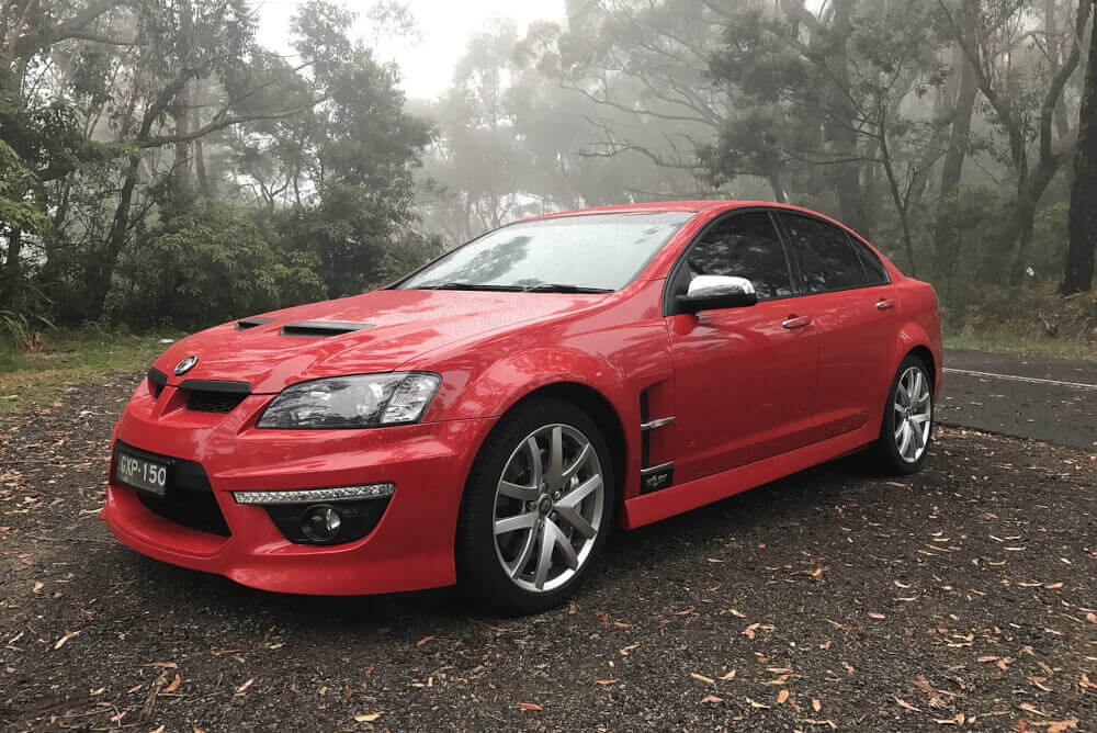 A red Holden on the side of the road