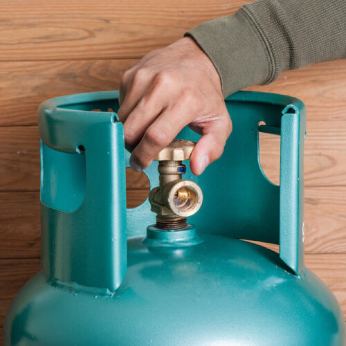 Man using gas cylinder