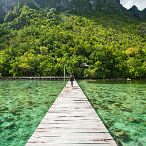 Person a pier in Indonesia