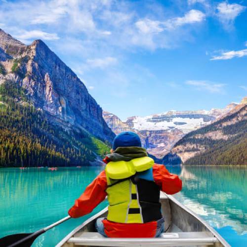 Person kayaking in Lake Louise Banff Canada