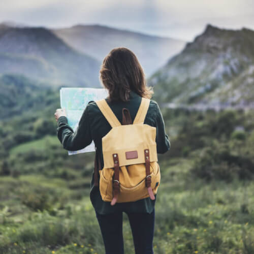 Woman with a travel insurance hiking