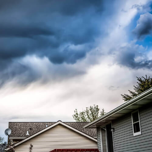 house with storm overhead