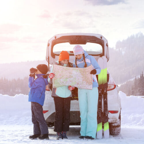 Family on ski holiday with family travel insurance