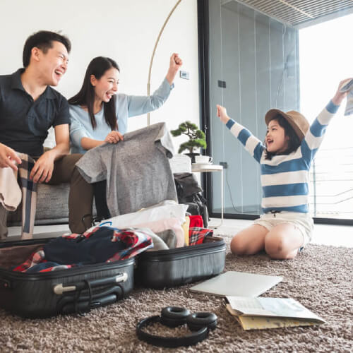 Family packing luggage for overseas holiday