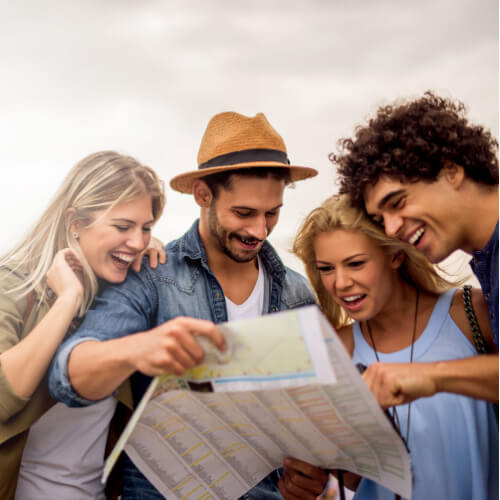 Smiling students on a trip with travel insurance