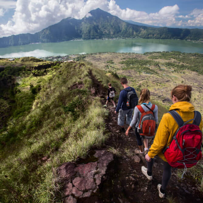 hikers climbing with volcanic ash in Indonesia