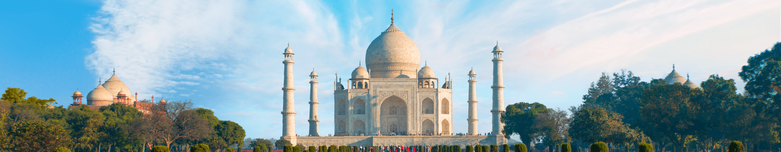 India Taj Mahal mausoleum in front of cloudy blue sky