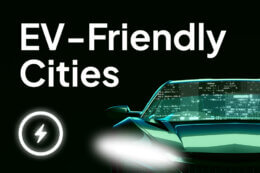 a green car with a white LED headlight on a black background with white letters in the top reading "EV-Friendly Cities" with a lightning bolt icon in a white circle in the bottom left corner.