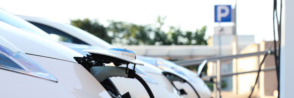 EV cars charging their batteries at a charging station.