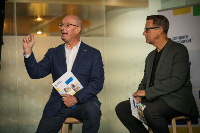 David Koch gesturing beside Andrew Winter at Compare the Market's 2025 Household Budget Barometer Q&A launch