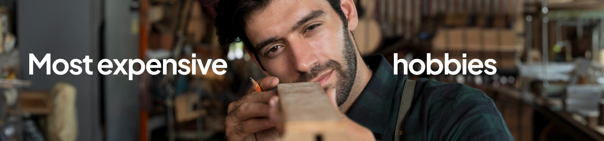 A close-up view of a person carefully inspecting a wooden plank in a workshop environment, with tools and materials blurred in the background. The words ‘Most expensive hobbies’ appear in large white text across the image.
