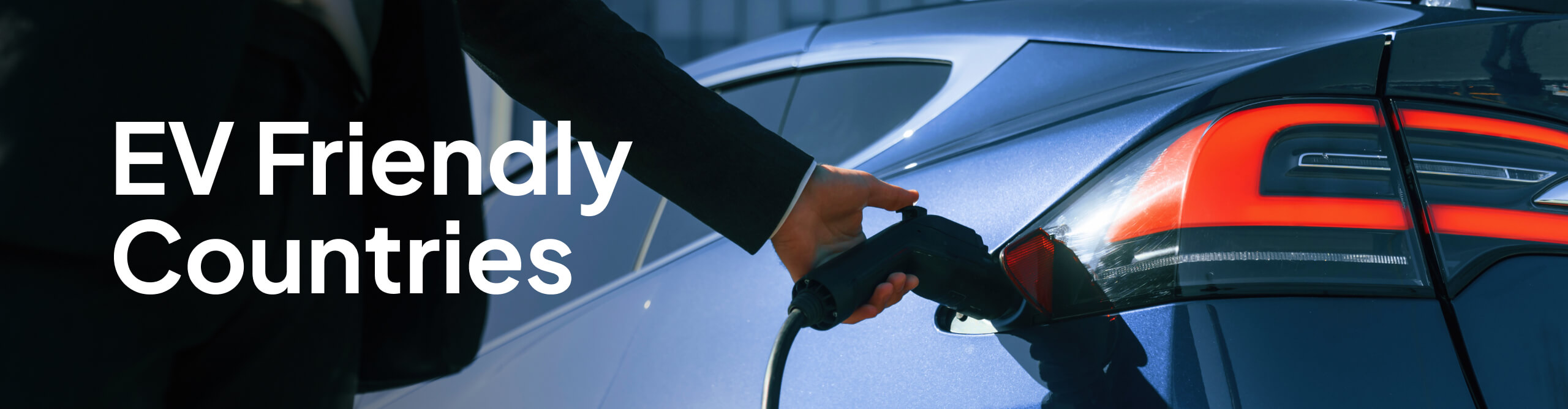 Person charging a blue electric vehicle in a modern outdoor setting with ‘EV Friendly Countries’ headline.