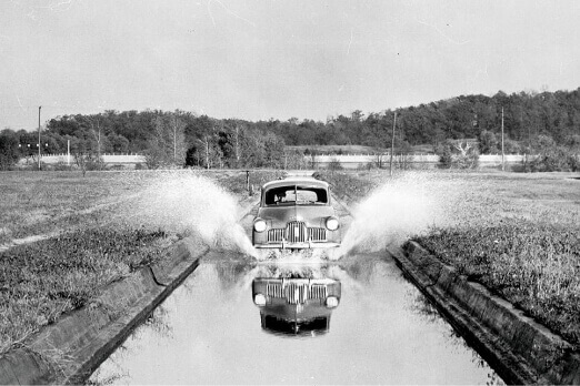 Holden FX driving through water