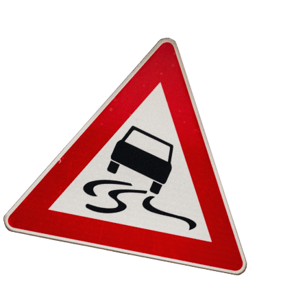 A road sign warning that the road may be slippery